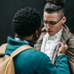 Bully assaulting fellow student at school.